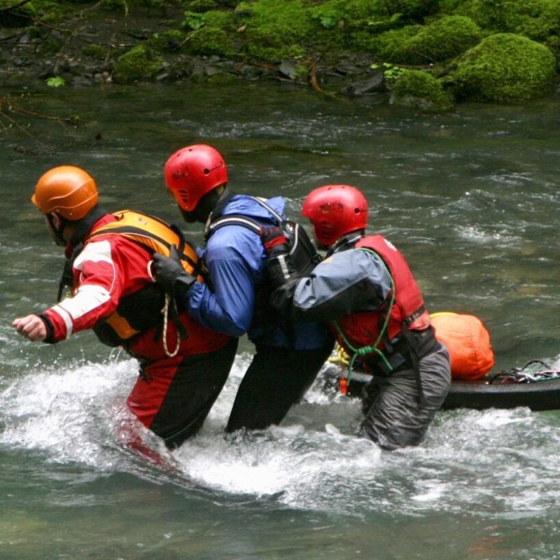 a group of people riding on a raft in a body of water