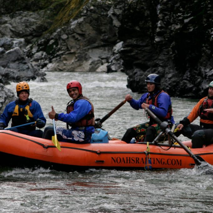 a group of people riding on the back of a boat