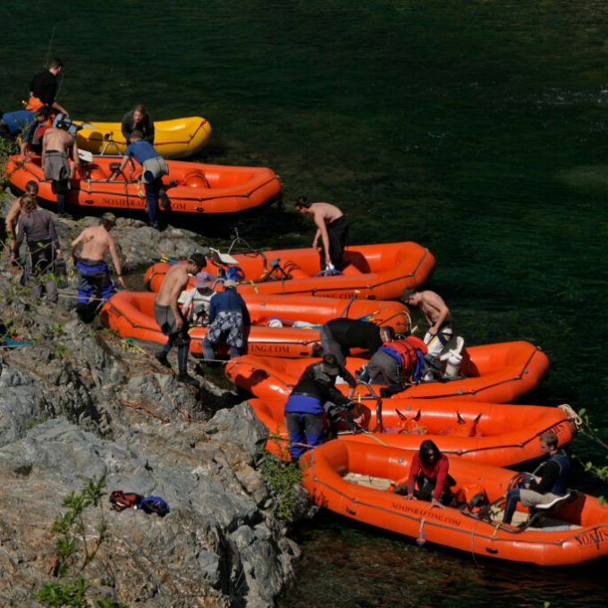 a group of people on a raft