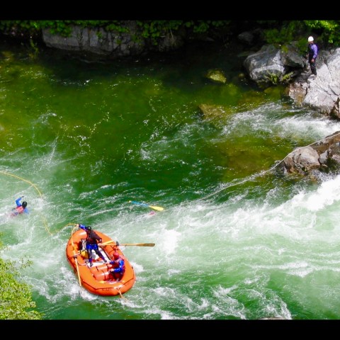 a man riding a wave on a surfboard in the water