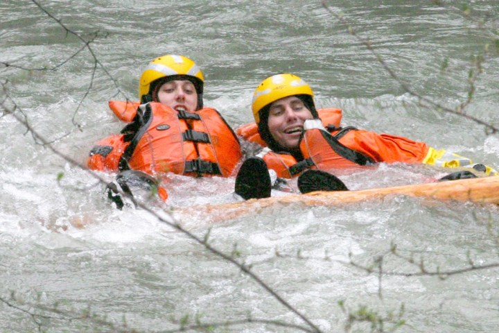 a person riding on the back of an orange