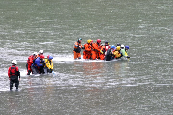a group of people on a boat in the water