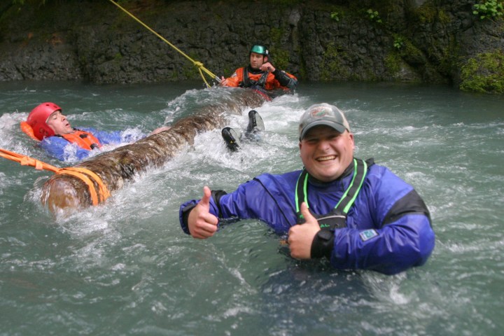 a group of people riding skis on a body of water