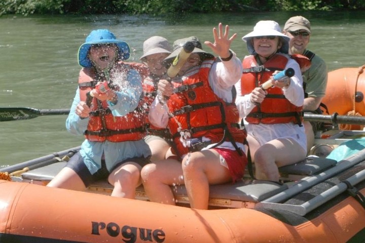 a woman sitting on a raft in a body of water