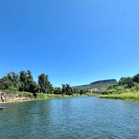 a boat on a lake next to a body of water