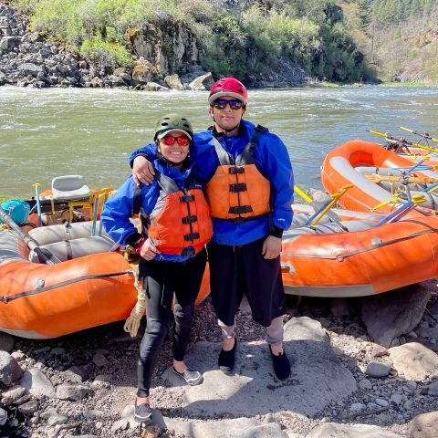 a group of people on a raft in the sand