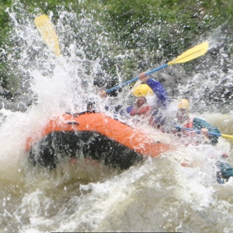 a man riding a wave on a surfboard in the water