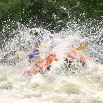 a person riding a wave on top of a body of water