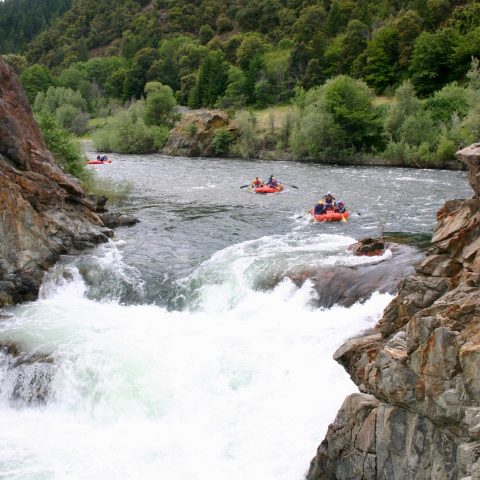 a large waterfall over a body of water