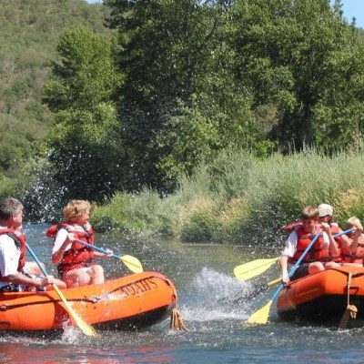 a group of people riding on the back of a boat