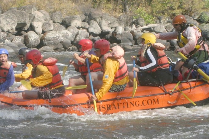 a group of people on a raft