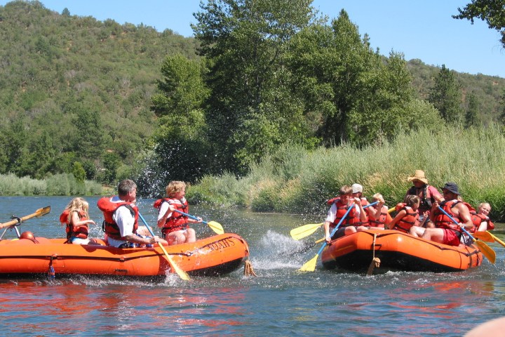 a group of people riding on the back of a boat