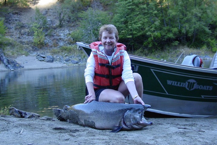 a person sitting on a boat in the water