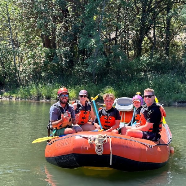 a group of people riding on the back of a boat