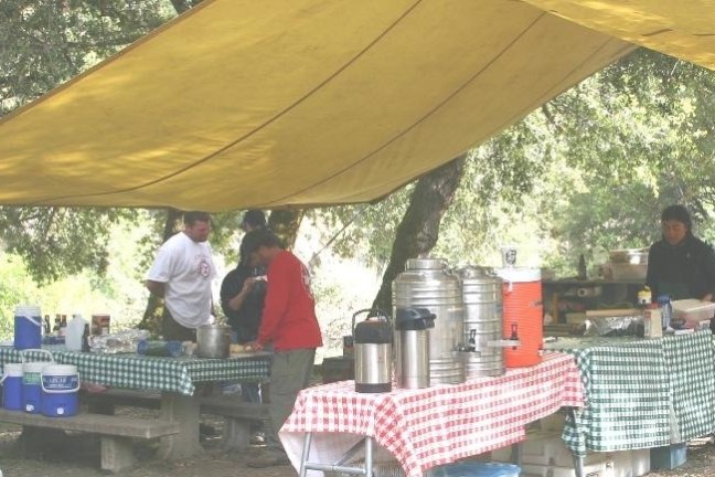 a man sitting at a picnic table