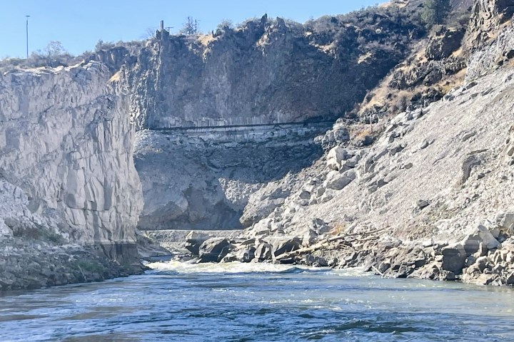 a man riding on top of a mountain