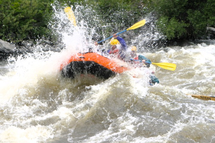 a man riding a wave on a surfboard in the water